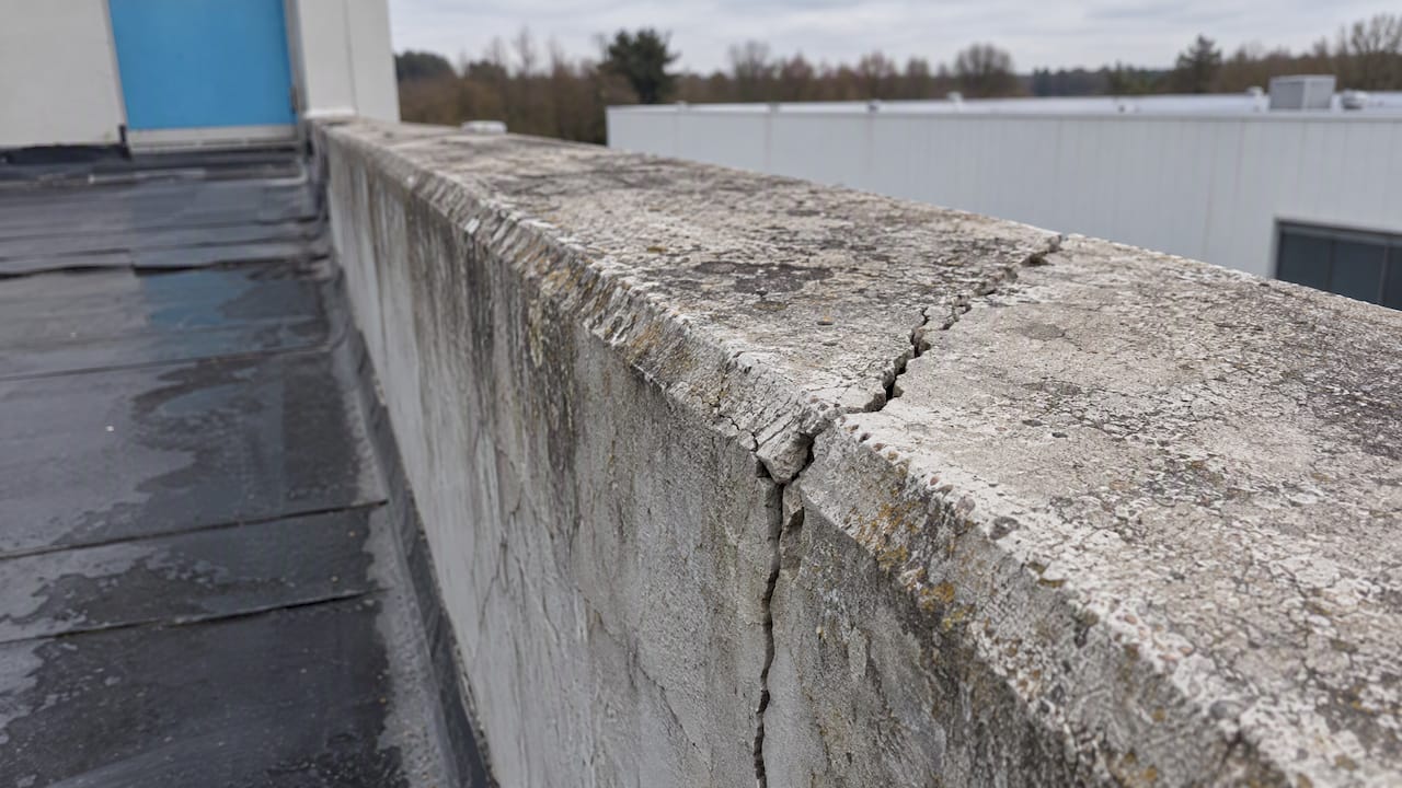 Crack visible along a weathered rooftop parapet